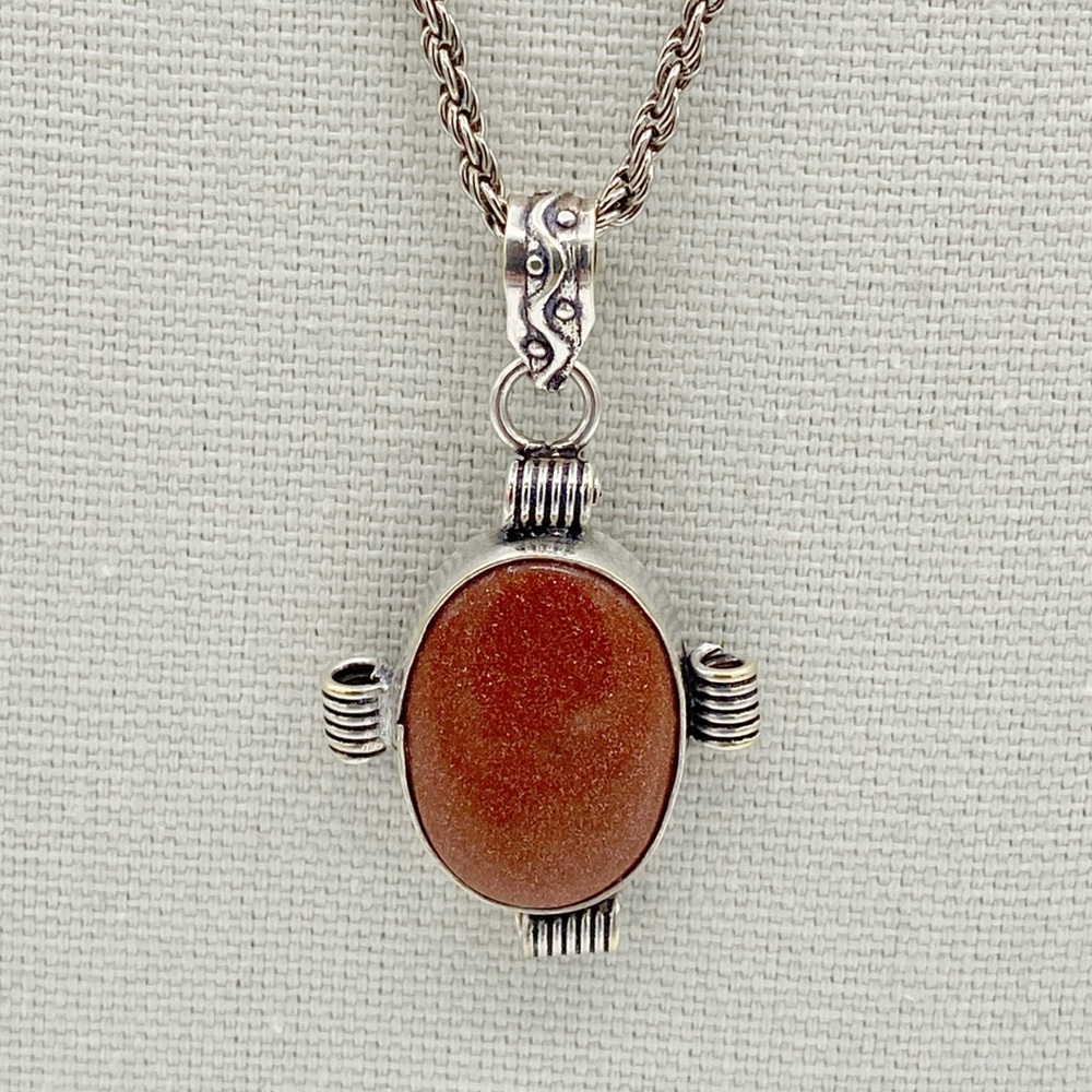 Sandstone Pendant On A Silver Tone Necklace